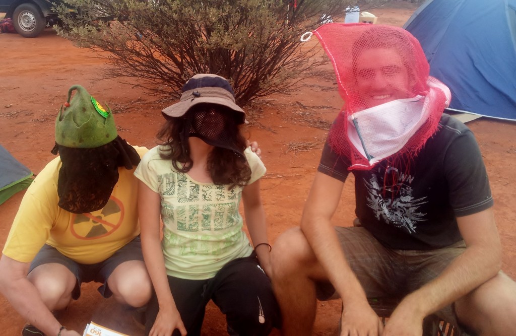 Pekka with laced underwear, me with a shoe bag and alex with an orange bag, all to keep the flies away!
