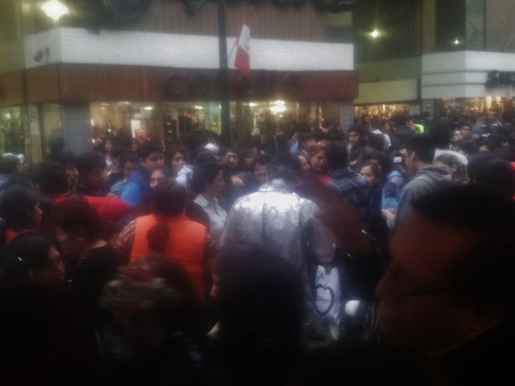 The Human statue in silver surrounded by the crowd after the attack.